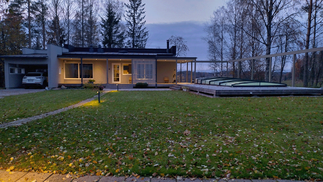 Salo yard sauna in its rural setting of meadows, with a view to the lake.