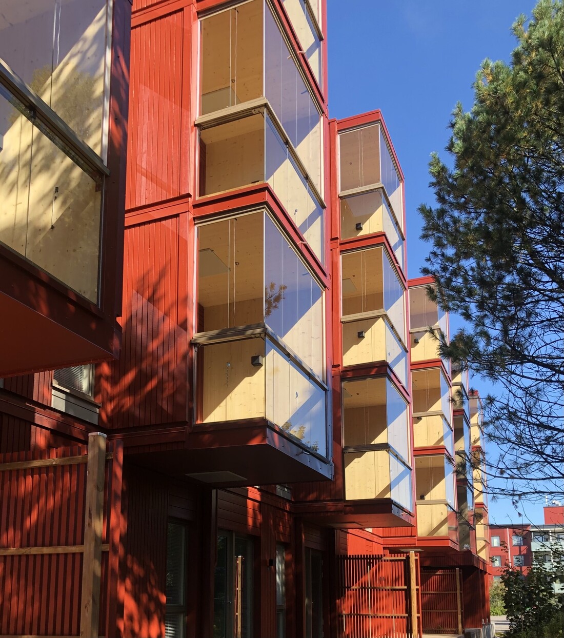 The Pasuunakuja apartment buildings have CLT-structured balconies and timber-frame facades.