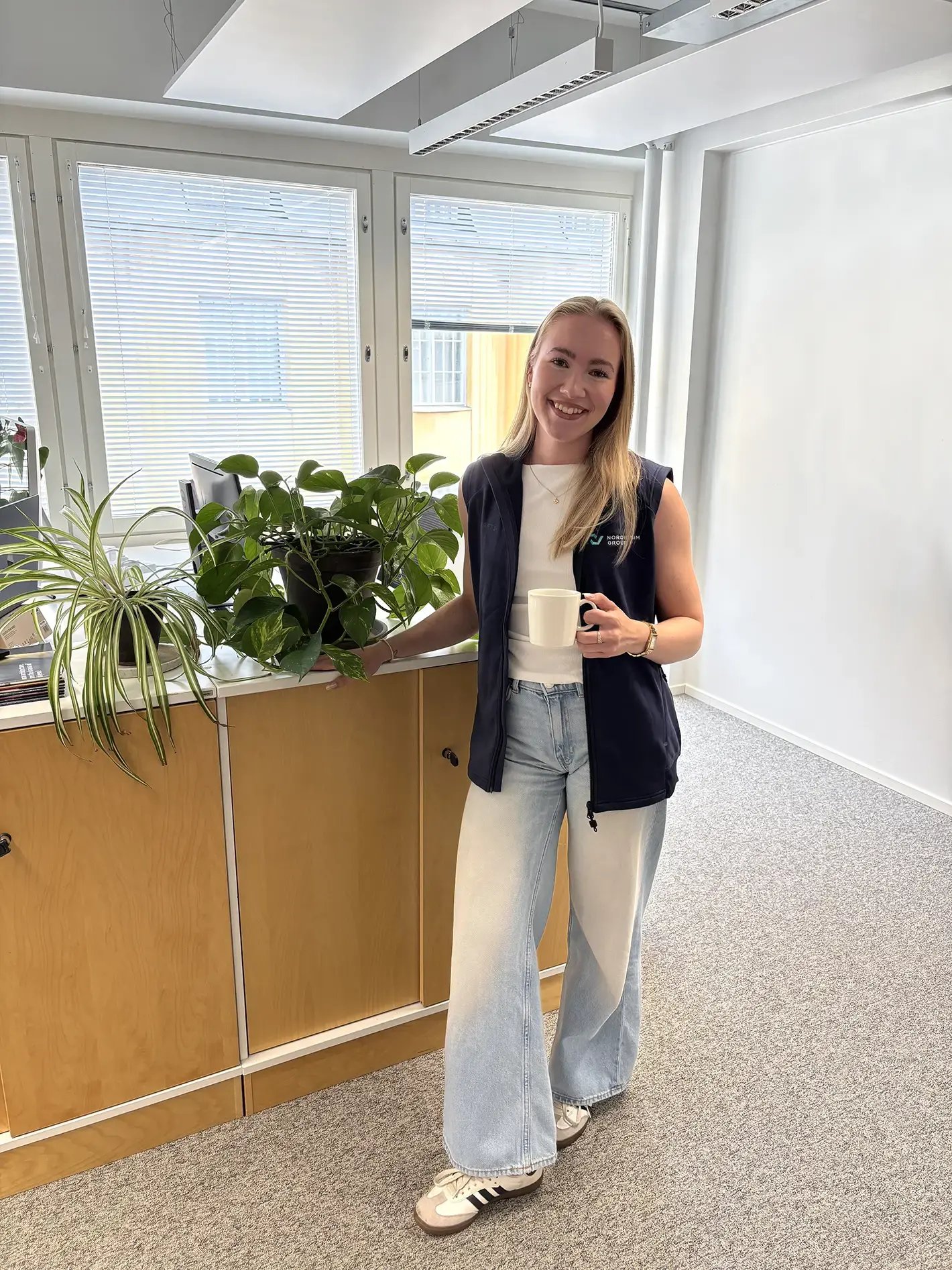 Ella Muona standing in the Nordic BIM Group office.