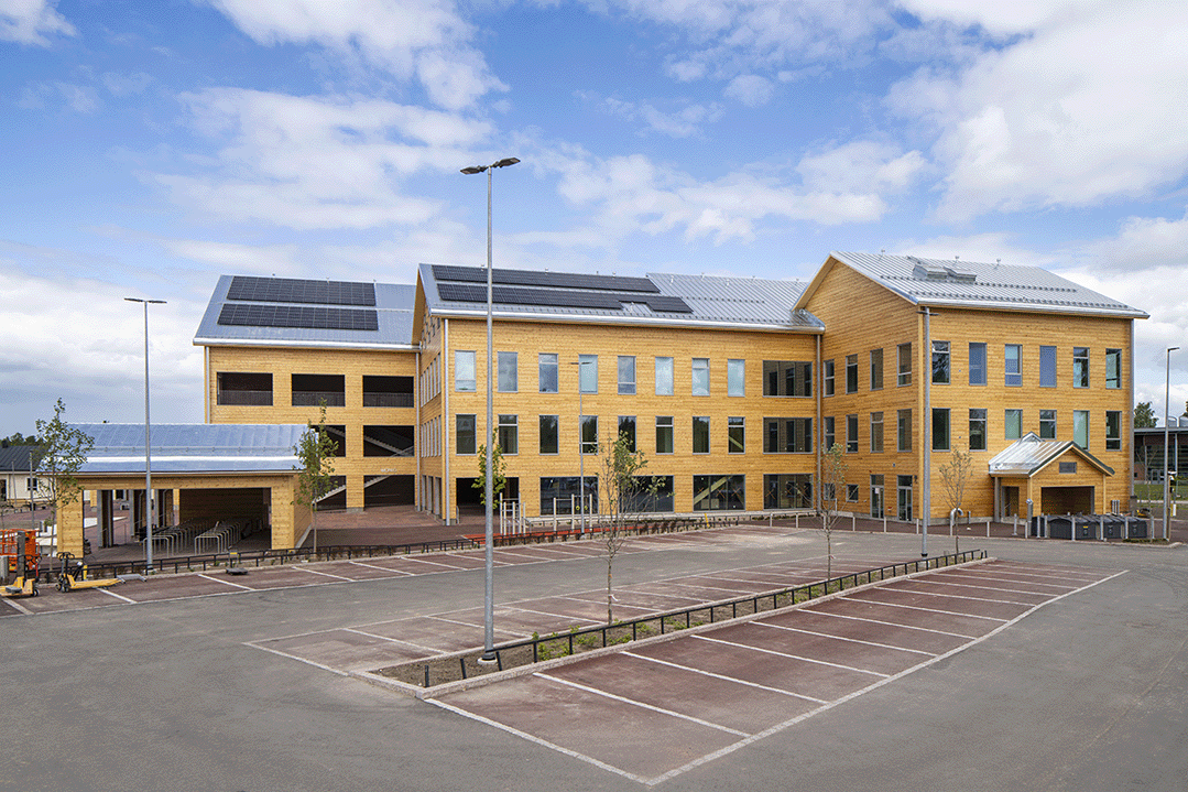 Monio, flerbruksbygget i Tusby i Finland, arkitektur av AOR Arkkitehdit, med Kontios tømmerdesign og tømmer.