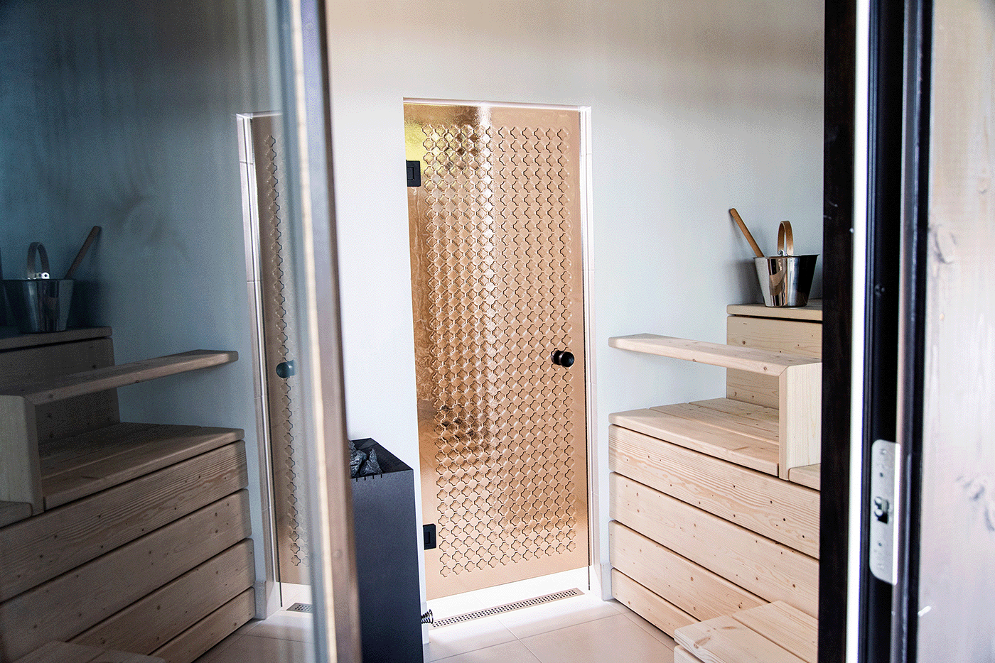 Custom Retro artisan glass panel set in a wood sauna door, designed by Minna Haapakoski.